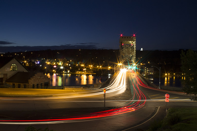 Photograph of a bridge at night.
